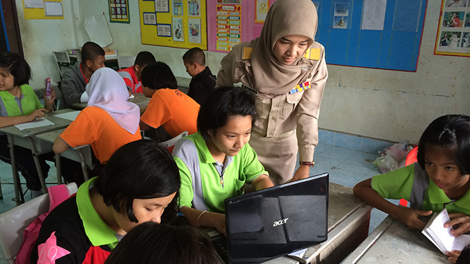 Khadiyah Amanakun works with English-language students in her technologically intensive program, located in Betong, Yala