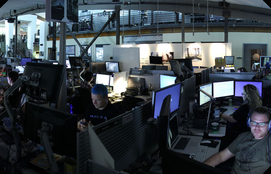 Game developers in darkened office space at 343 Industries in Kirkland, Washington