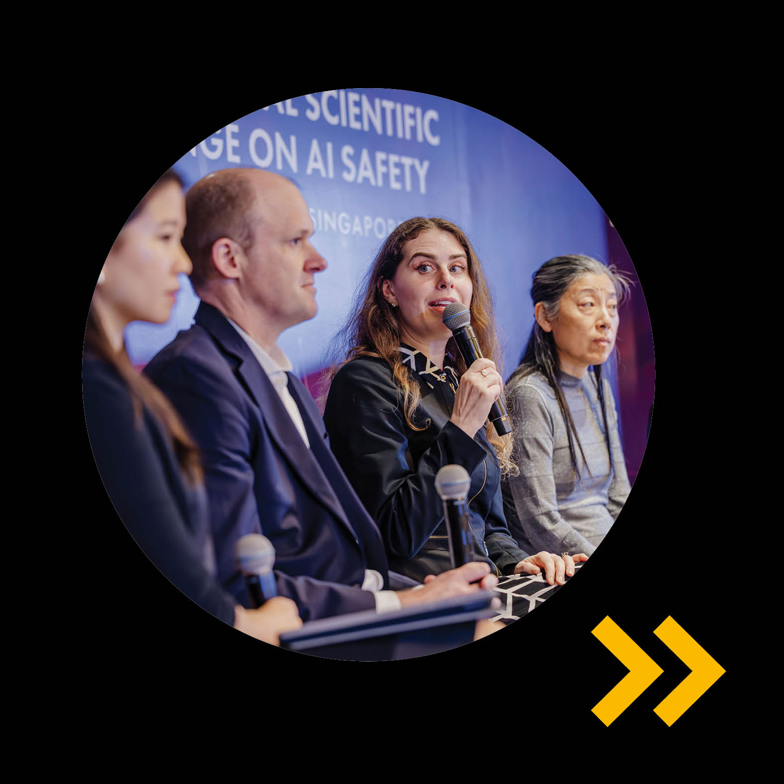 Four people sit on an AI Red Teaming panel at the International Scientific Conference on AI Safety in Singapore, with one woman speaking into a microphone.