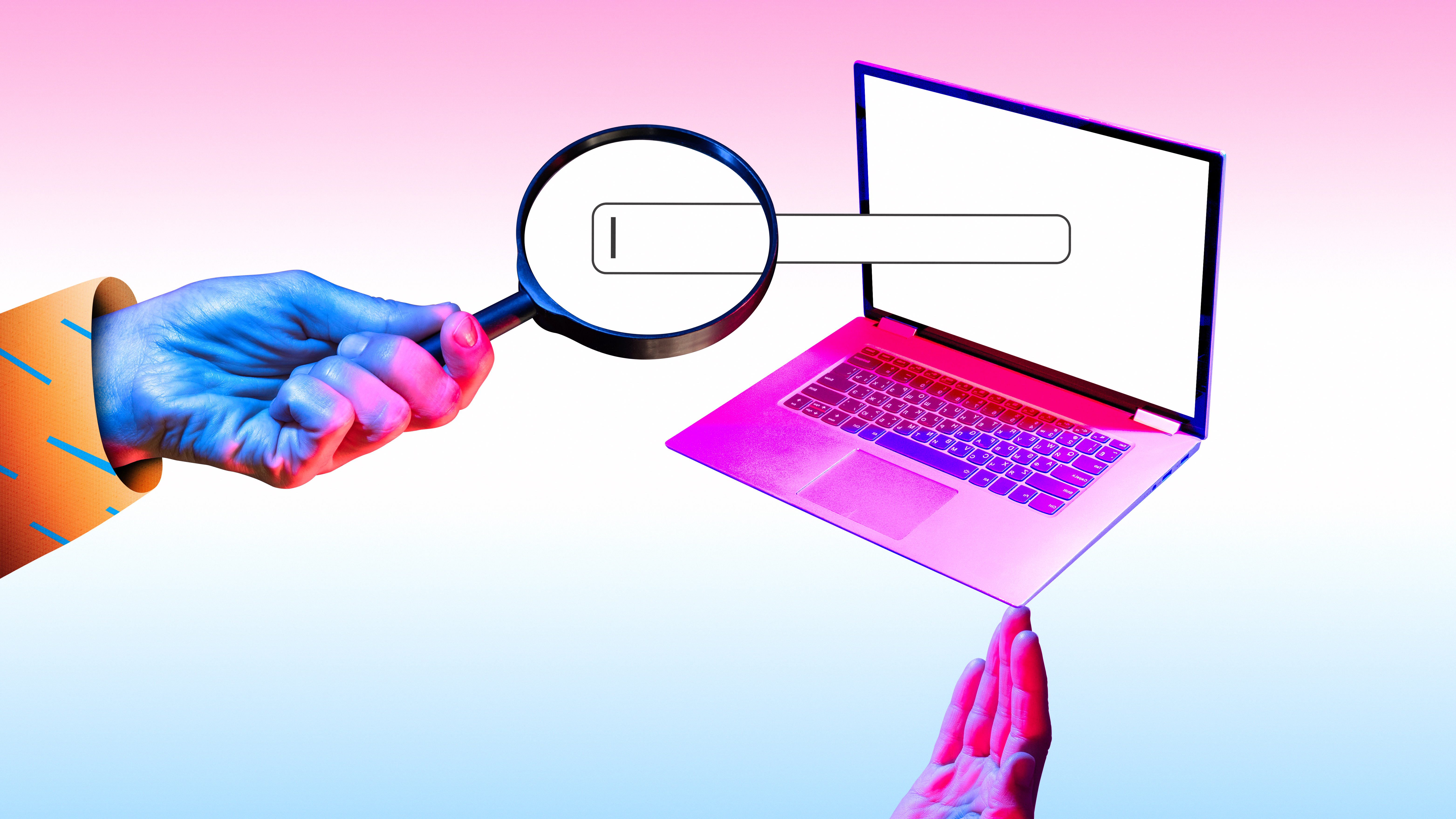 Magnifying glass over a search bar in front of a laptop with colorful lighting.