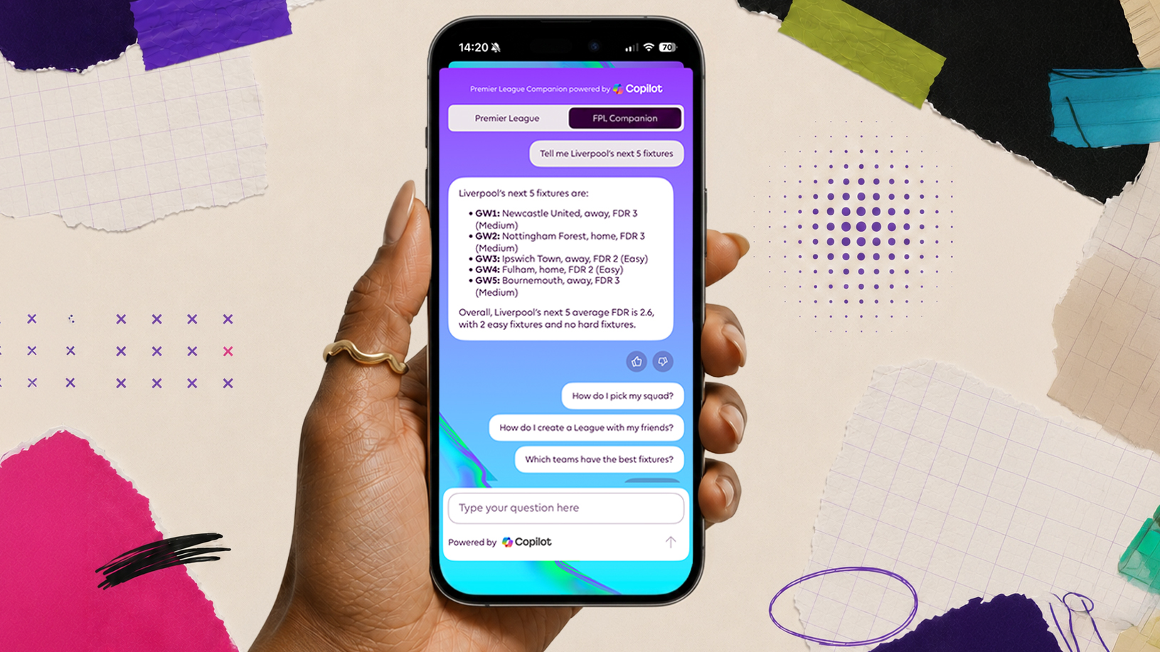 Hand holding a smartphone displaying a Copilot-powered Fantasy Premier League assistant interface surrounded by colorful paper textures and design elements.