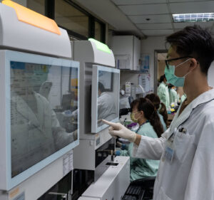 doctor using touchscreen monitor