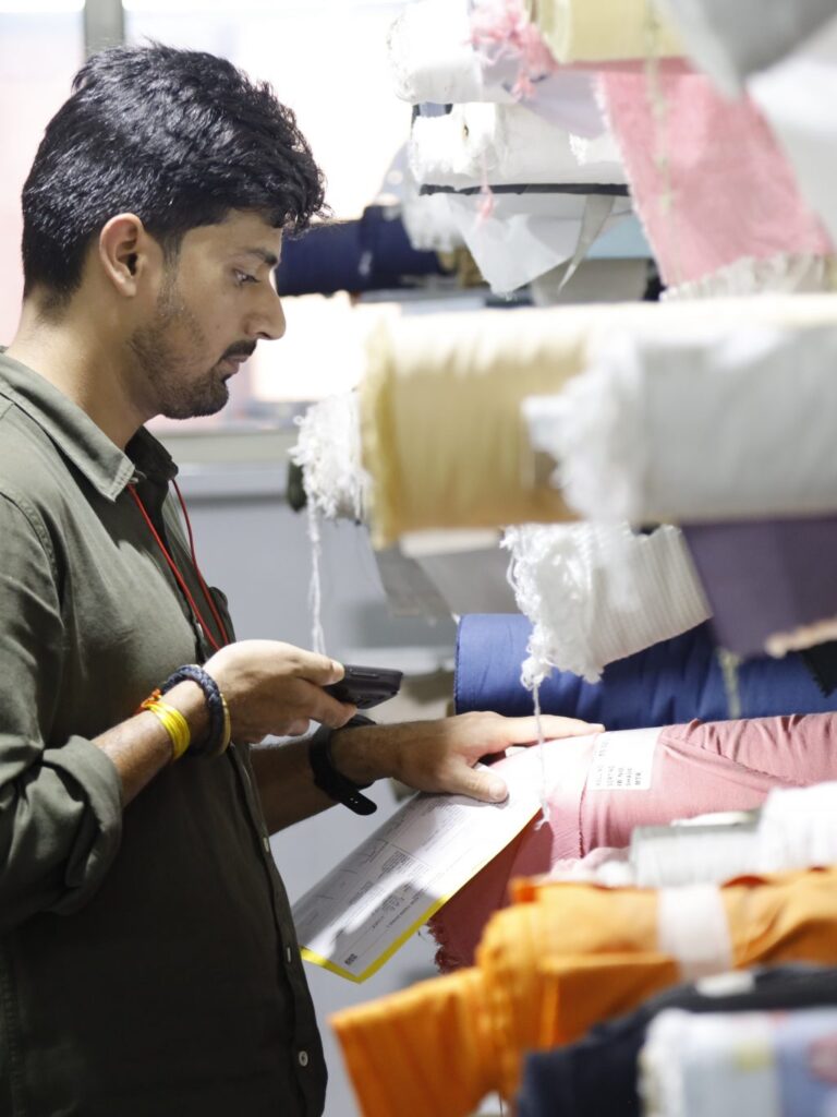 man scanning textiles with device