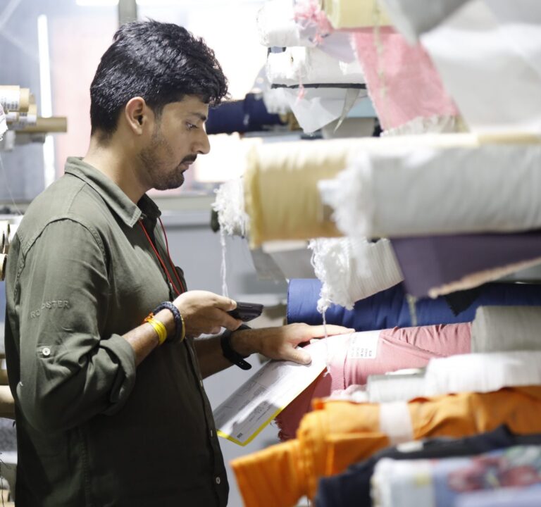 man scanning textiles with device