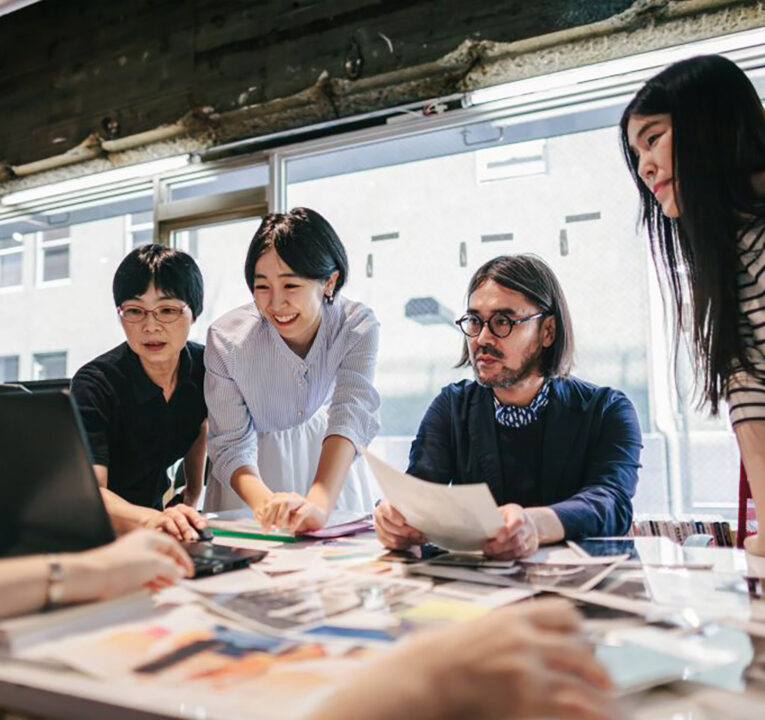 People at an office community table