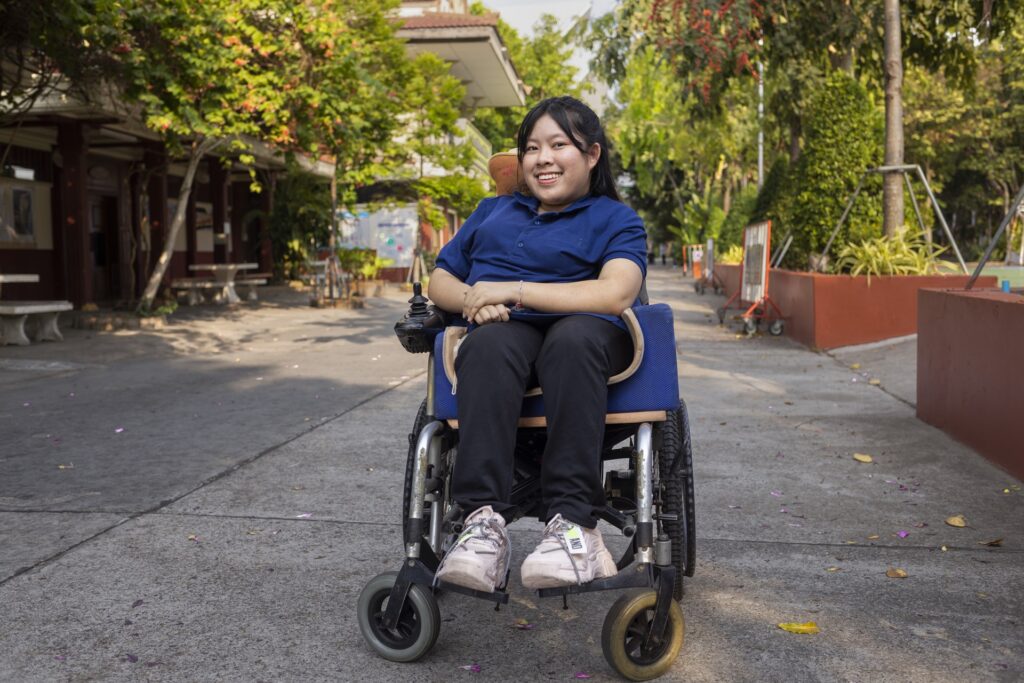 Woman in a wheelchair smiling