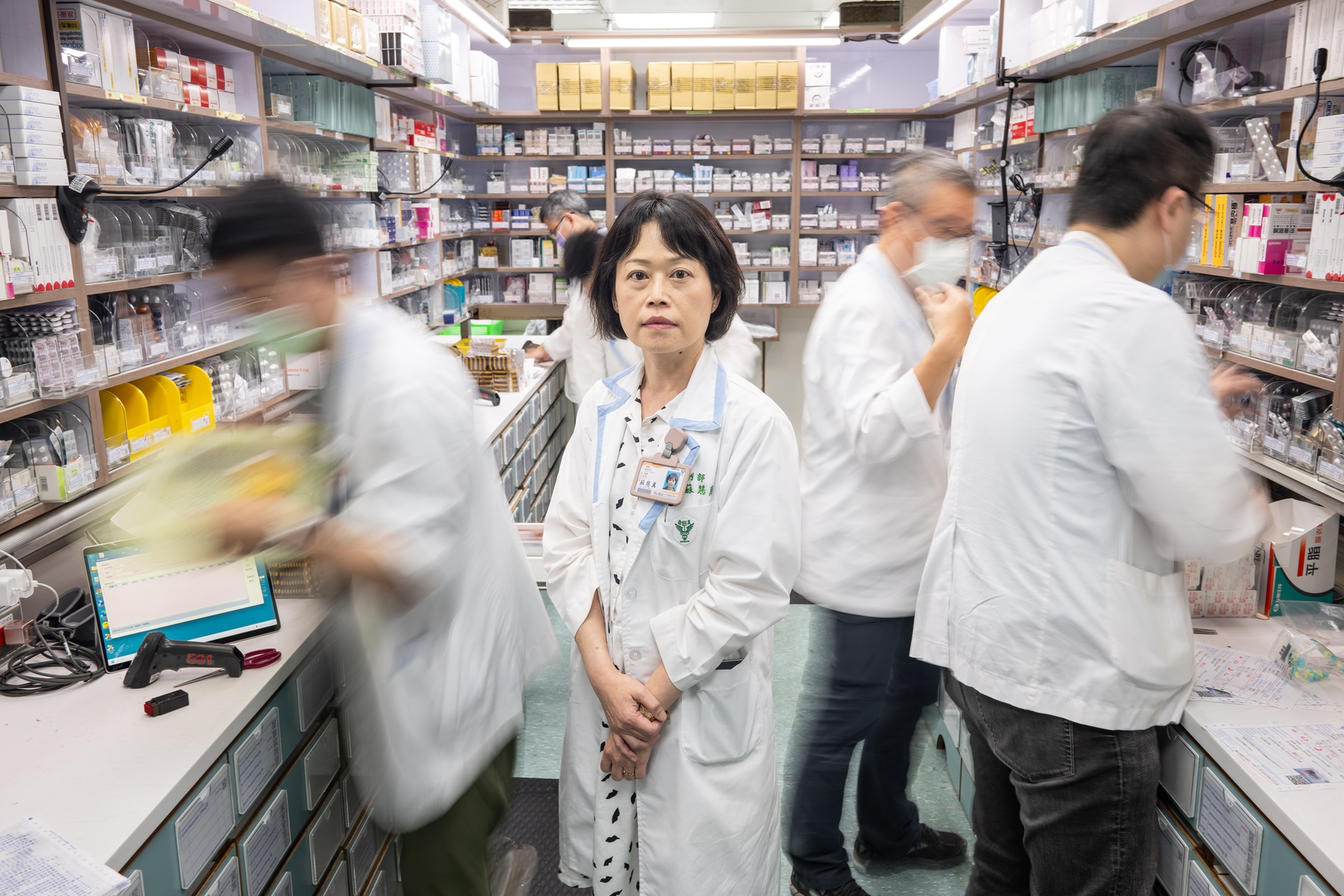 A group of people in a pharmacy