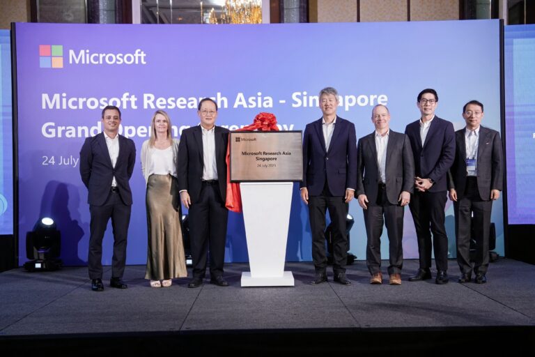 People standing on stage for the grand opening ceremony of Microsoft Research Asia Singapore