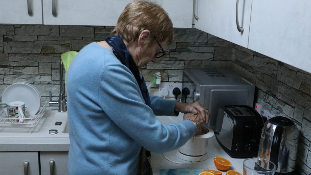 woman with juicing machine