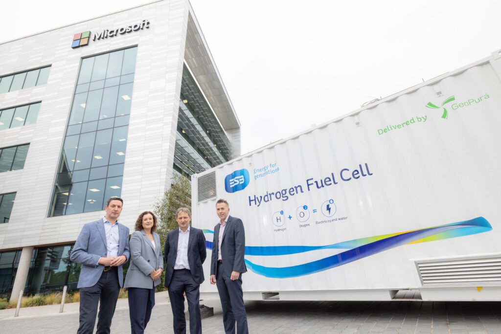 Four people in front of Hydrogen Fuel Cell at Microsoft Ireland