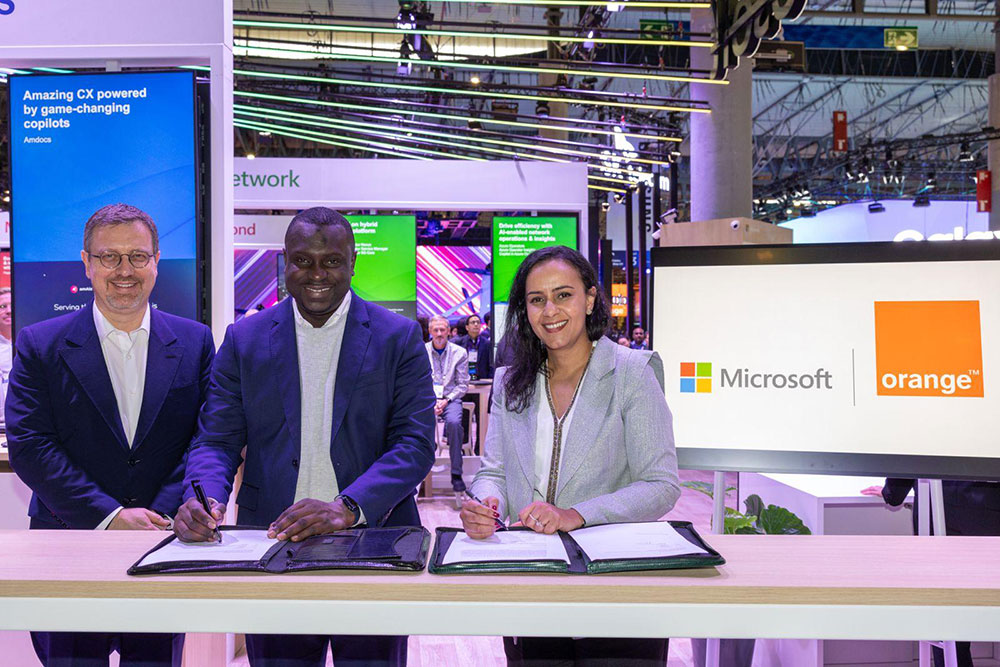 Executives from Microsoft and Orange at the official signing of the Memorandum of Understanding.