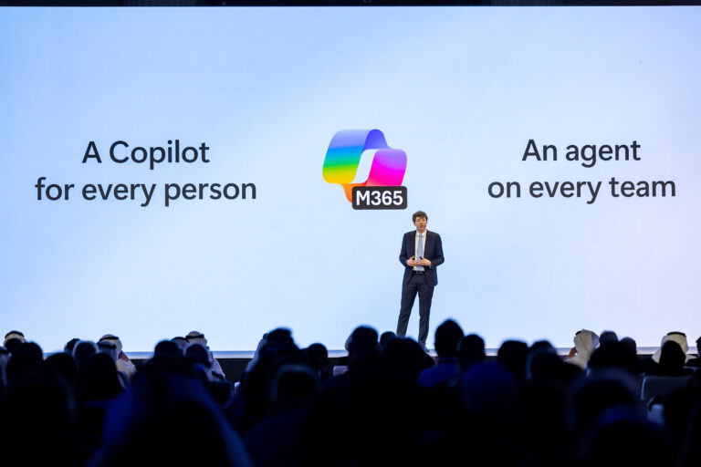 A person on stage delivering a keynote