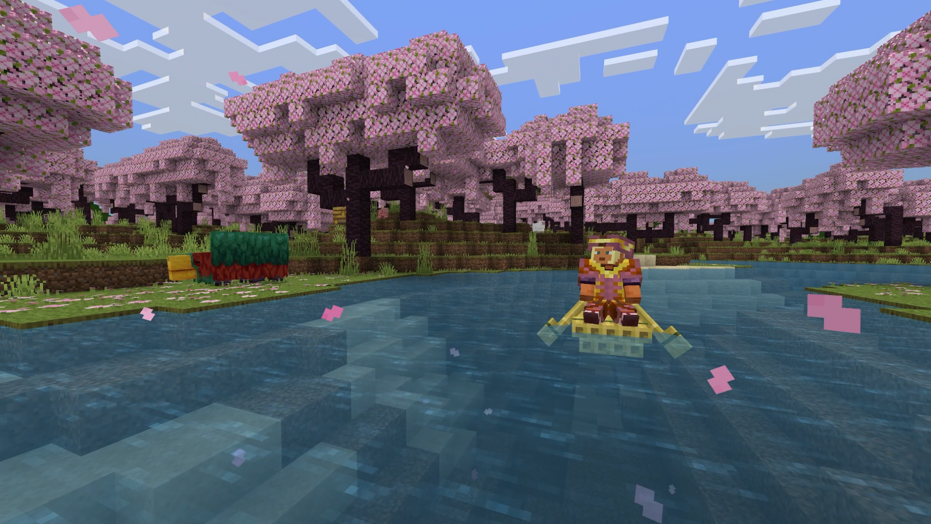Un jugador de Minecraft rema por un río a través de un bioma de cerezos en flor