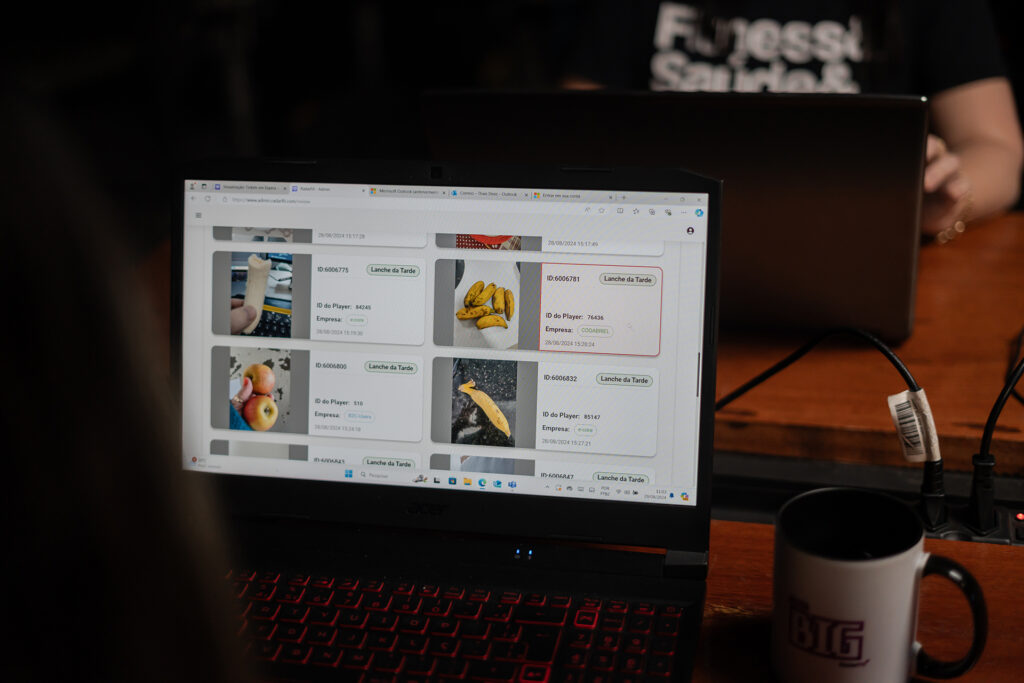 A laptop screen showing photos of various meals