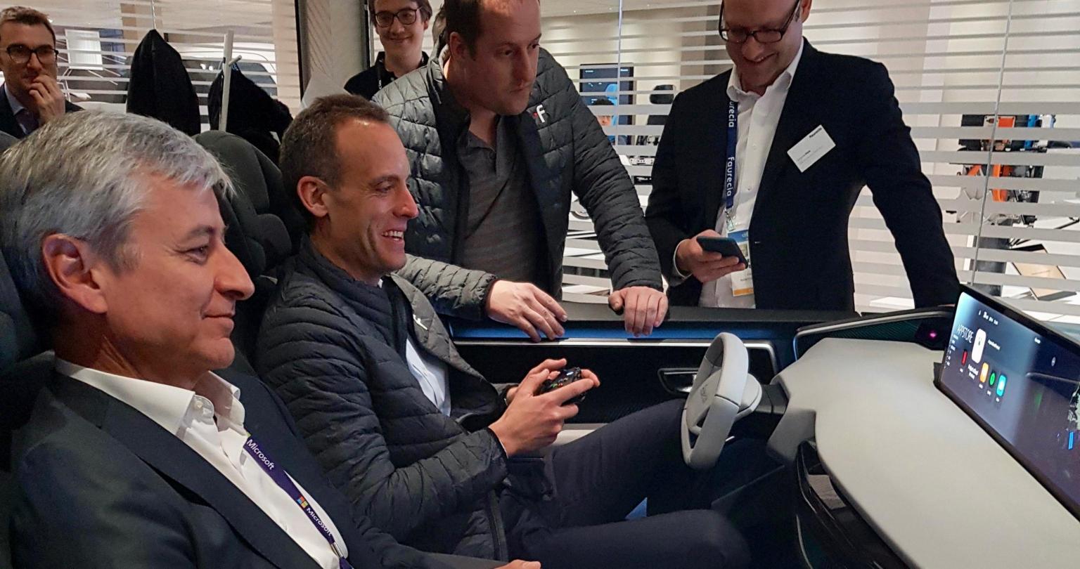 Jean-Philippe Courtois, Microsoft executive vice president, and president of Global Sales, Marketing and Operations, experiences Faurecia’s cockpit demo at CES 2020.