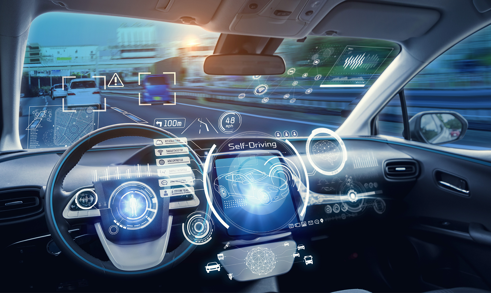 Photo showing dashboard of a self-driving car, with a roadway outside.