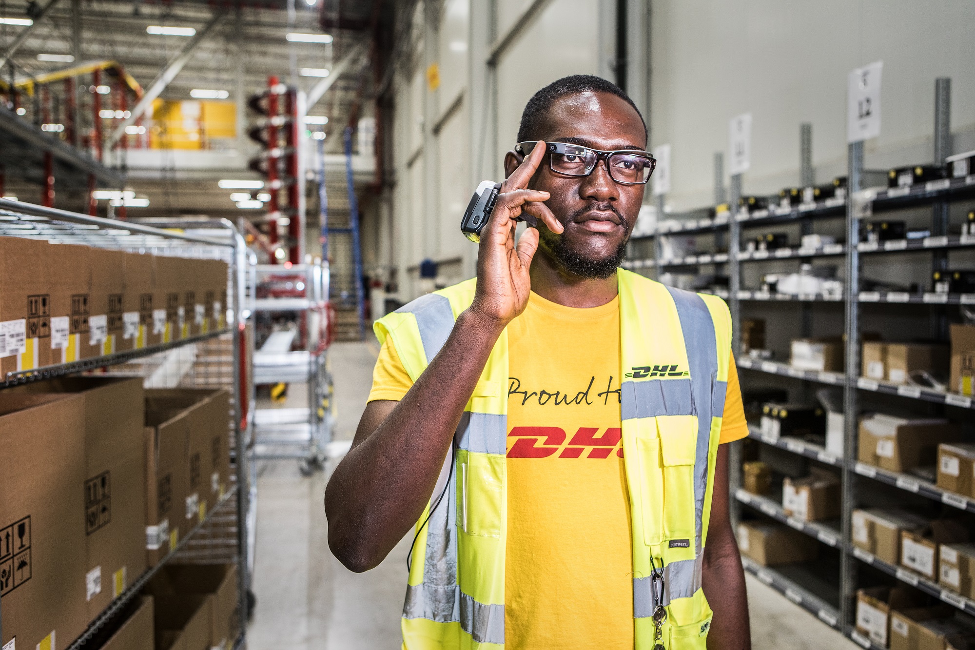 A DHL employee wears mixed reality glasses