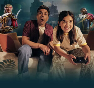 Father and daughter playing Sea of Thieves on a couch with two characters from the game portrayed behind them