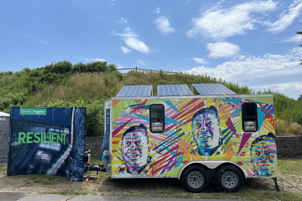 Image of solar-powered trailer with colorful exterior featuring images of Louisiana community leader Albertha Hasten. 