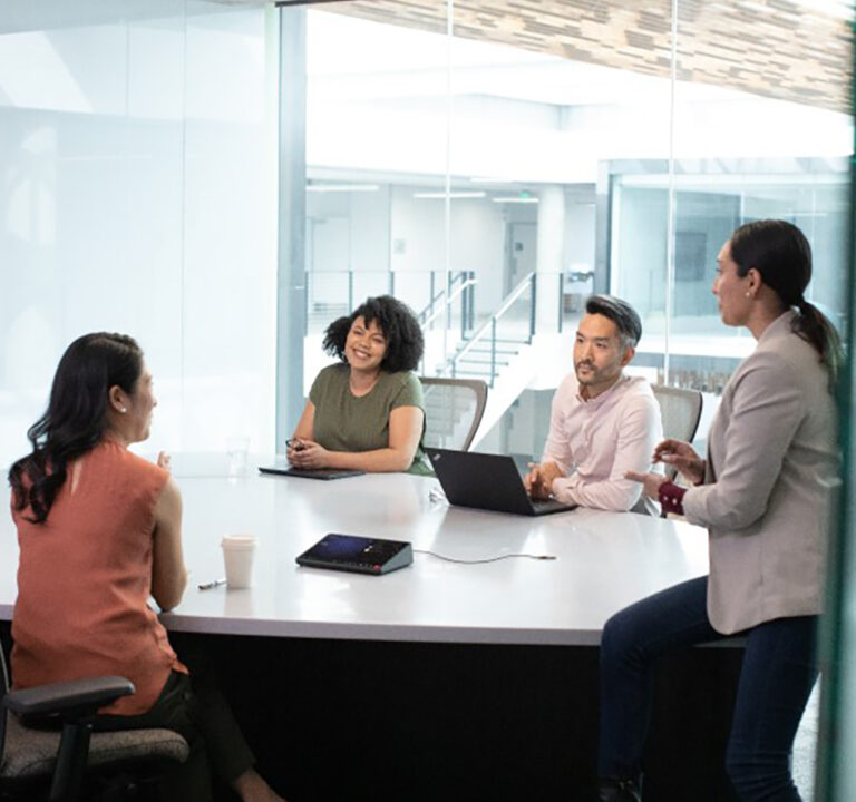 Four people meeting in an office