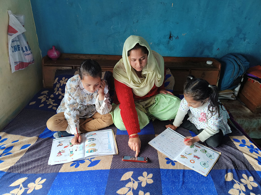 Kavita Ji in Dharamshala, India helping two little girls