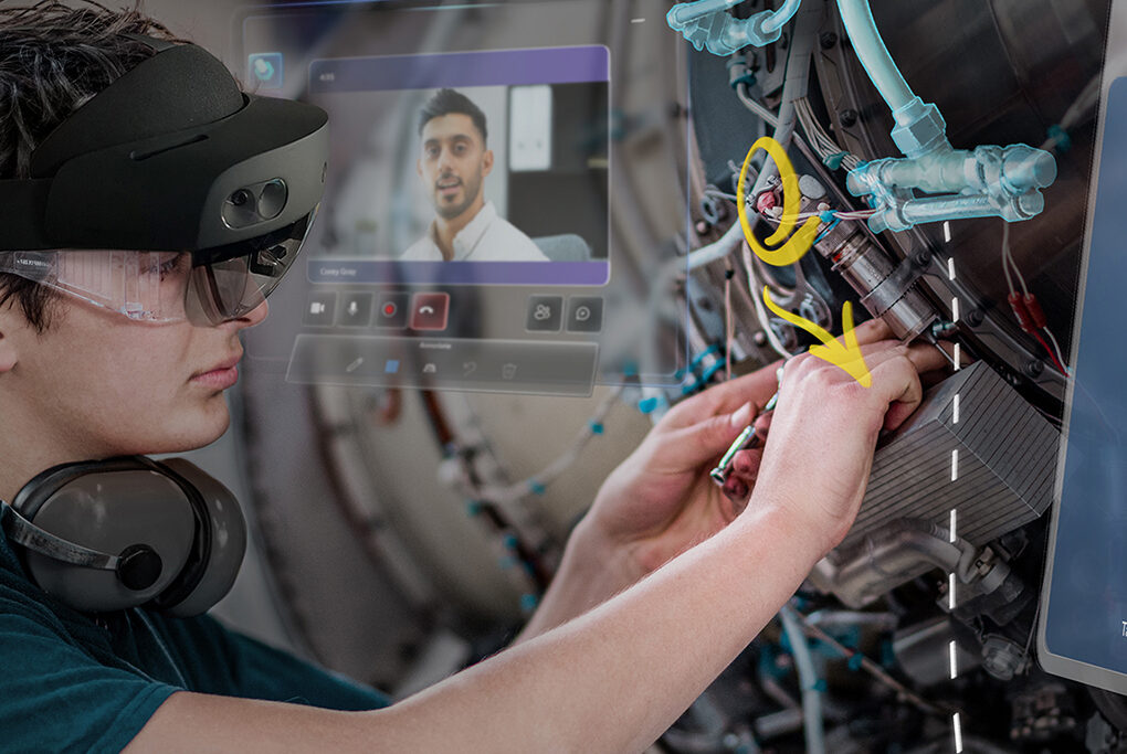 Person wearing a HoloLens device while working on an aircraft engine