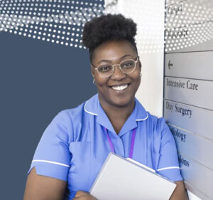 Nurse in a hospital holding a notebook and smiling