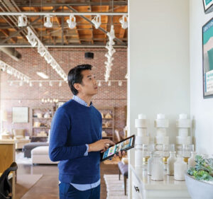 Man with a tablet device in a retail environment