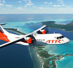 ATR 42-600 aircraft in flight over a tropical island