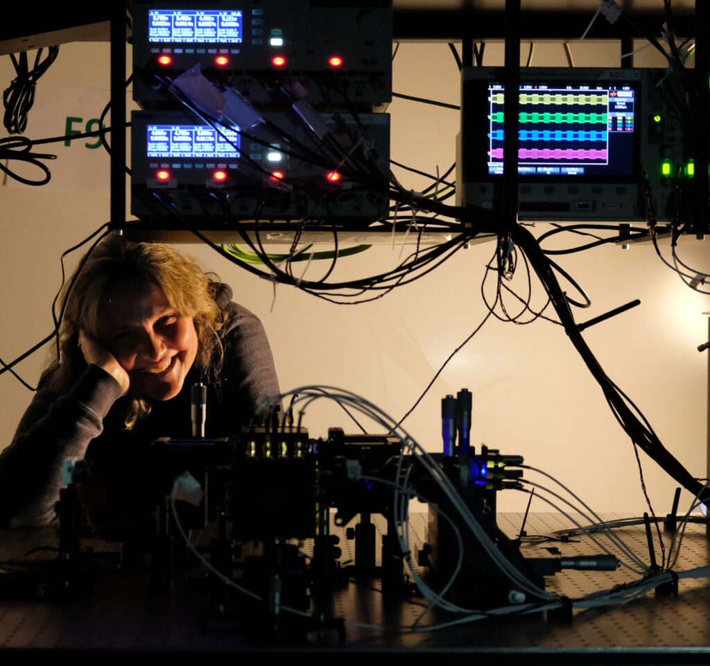 Francesca Parmigiani framed by wires lights and modulators