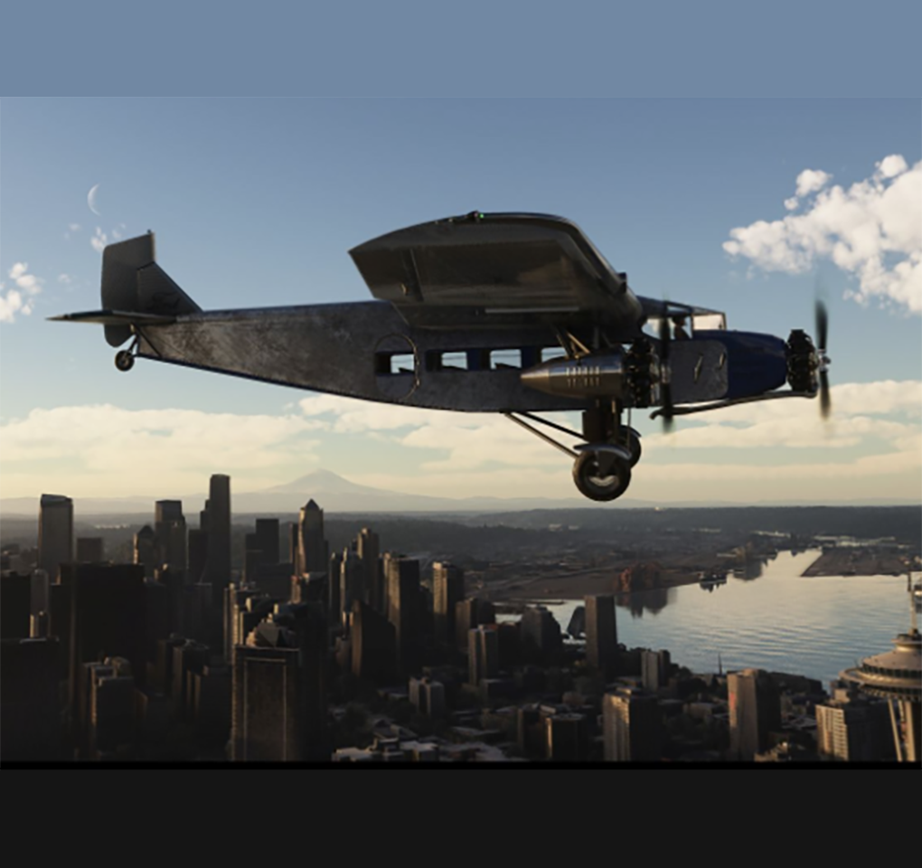 Ford 4-AT Trimotor in flight above Seattle at dusk