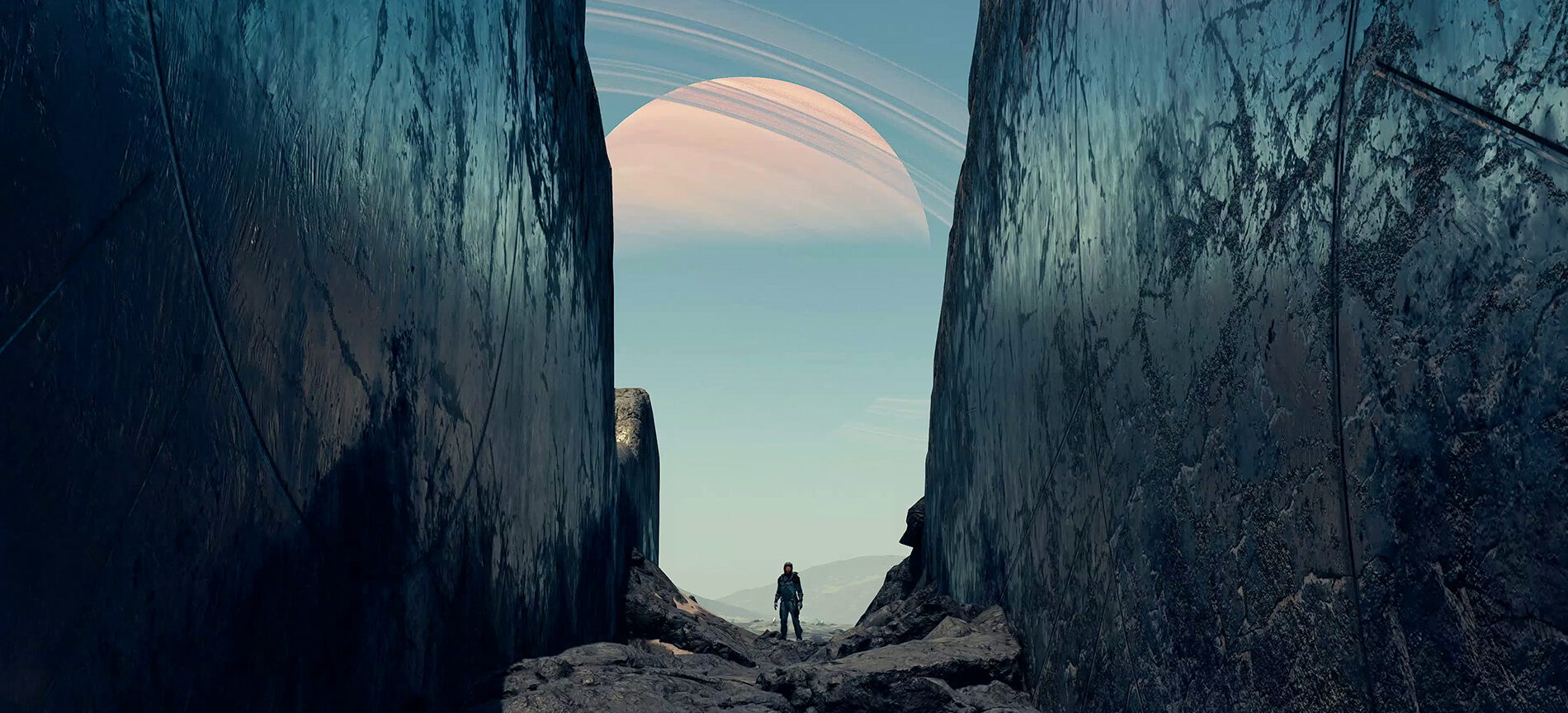 Person in a spacesuit stands on a planet