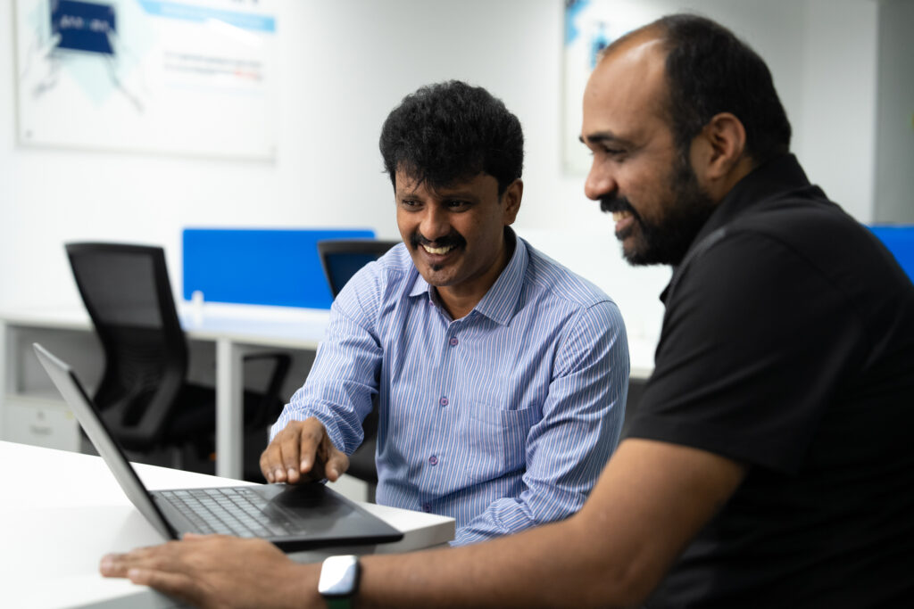 TN Senthil Kumar, an IT project lead at Genpact, with co-worker Sridhar Gnanasekaran at their office in Bengaluru