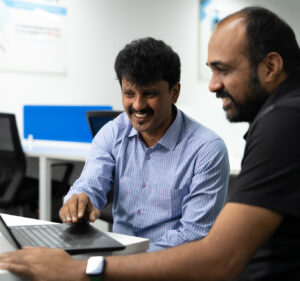 TN Senthil Kumar, an IT project lead at Genpact, with co-worker Sridhar Gnanasekaran at their office in Bengaluru