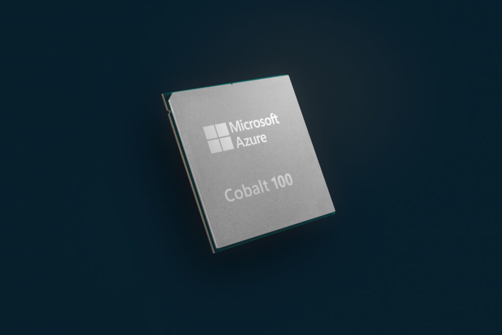 A close shot of a silicon chip with a Microsoft logo floating on a black background.