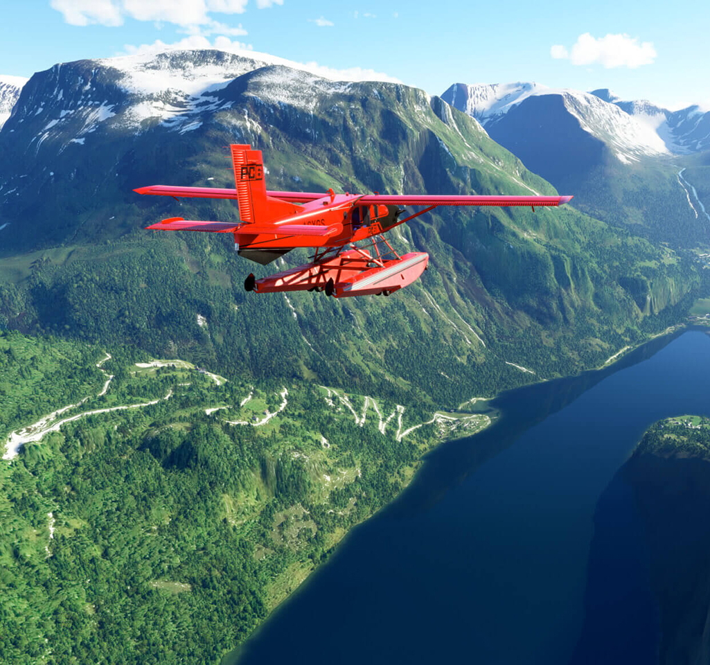 Red seaplane flying over green mountains and blue fjord