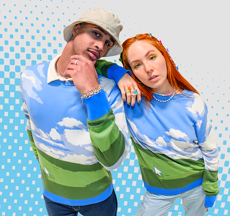 Twentysomething man and woman wearing Windows-themed sweaters