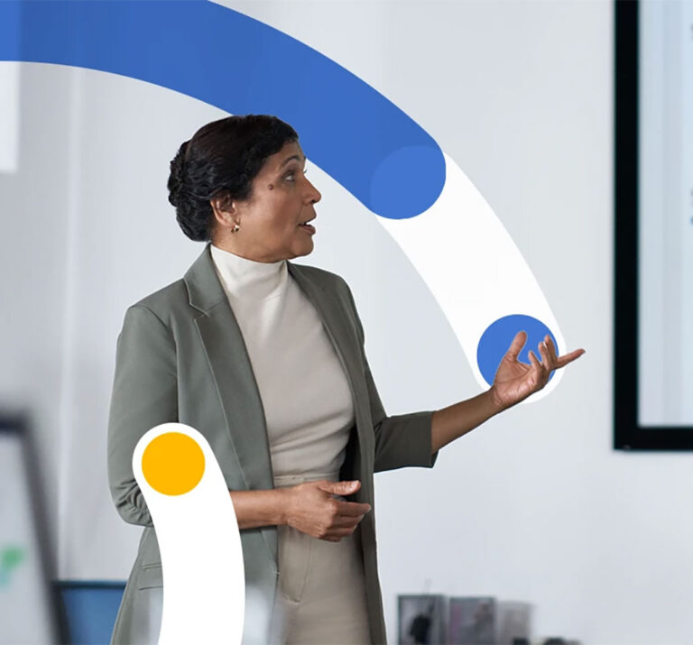 Woman presenting in front of a whiteboard