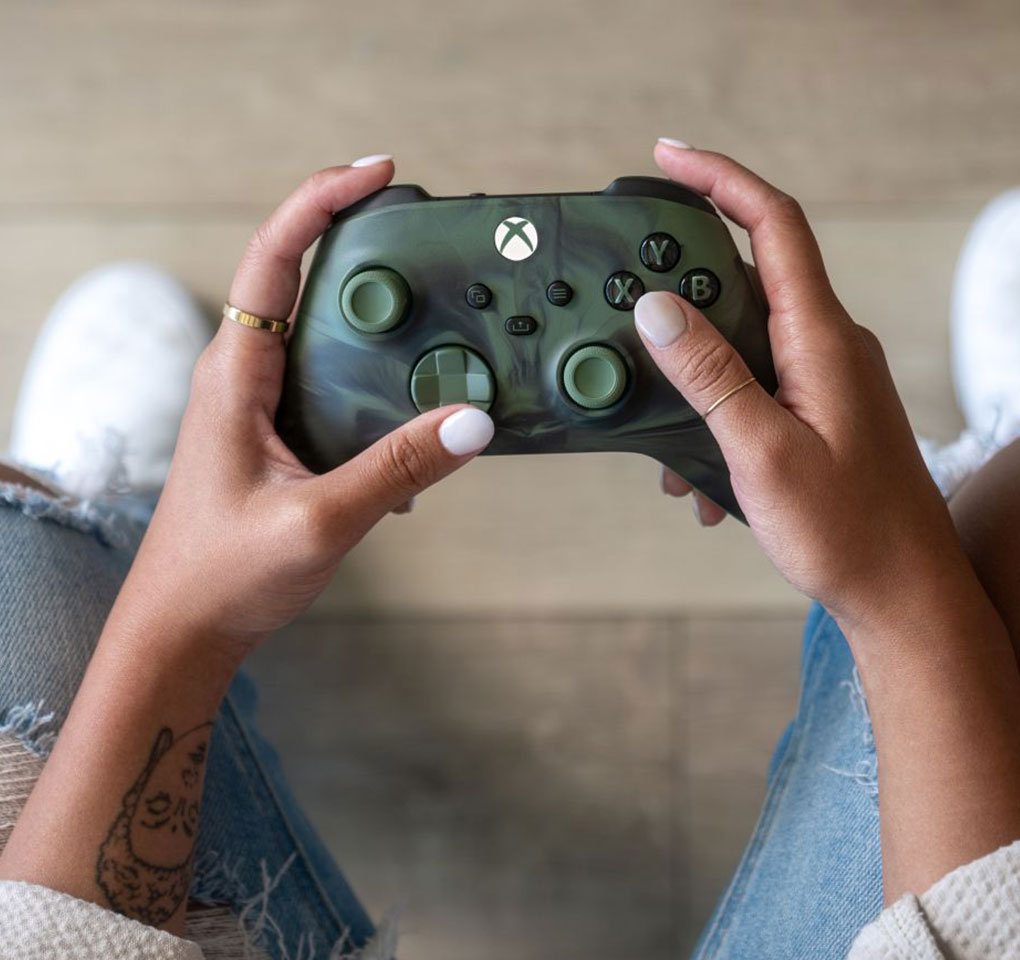 Pair of hands holding an Xbox wireless controller