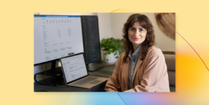 Woman sits in front of a laptop