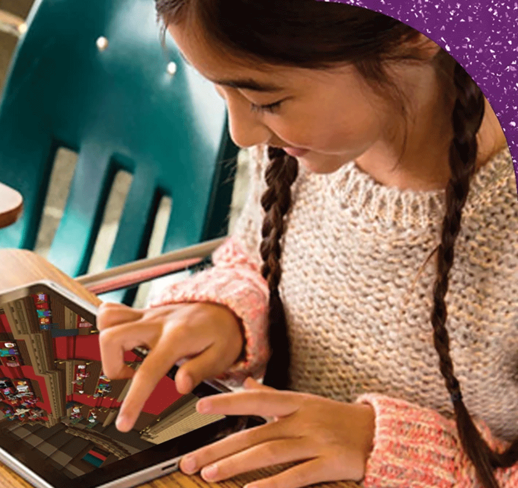 Schoolgirl typing on her laptop computer