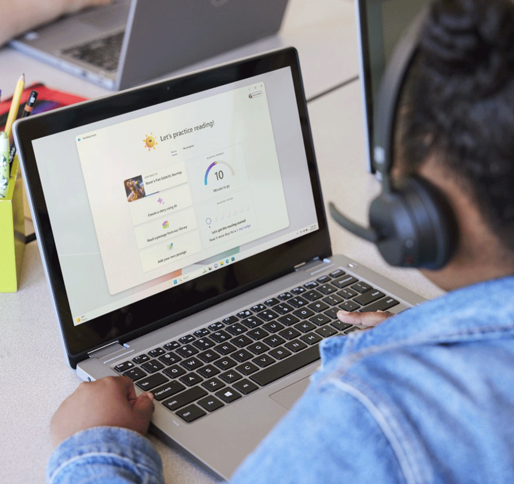 Young student using Reading coach on a laptop computer