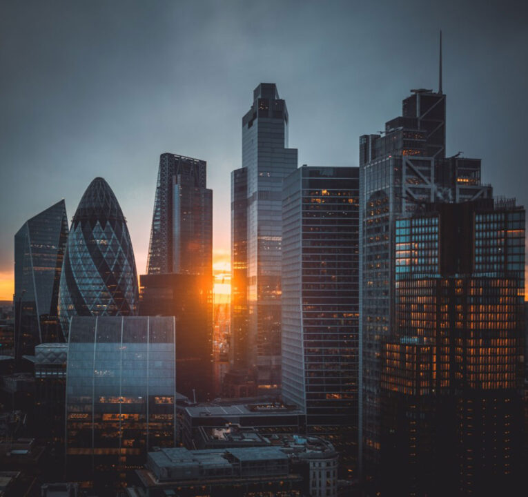 Skyscrapers against a sunset sky