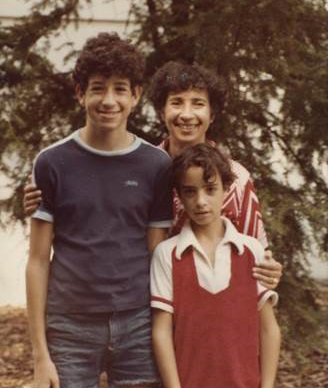 Young Amir with his mother and brother