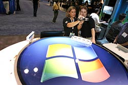 Microsoft’s Lisa Schlichting (left) shows Microsoft Windows Product Manger Ben Reed the Canon SD750, a Certified for Windows Vista digital camera, at DigitalLife at the Jacob Javits Center in New York Sept. 27, 2007.