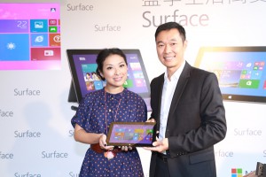 Horace Chow presents the Surface Pro 2 to Josephine Ng