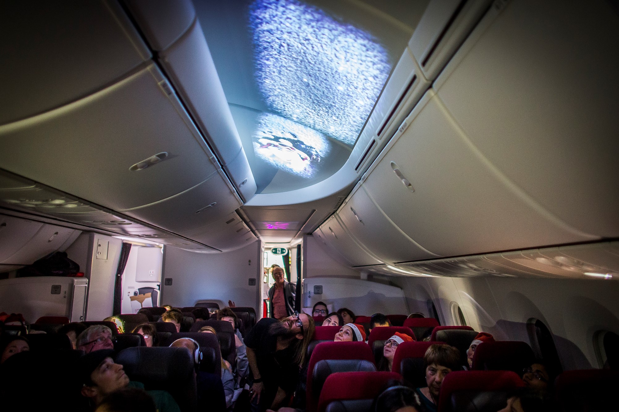 Through a series of projections on to the cabin ceiling, passengers watched the sleigh of Father Christmas land on the plane