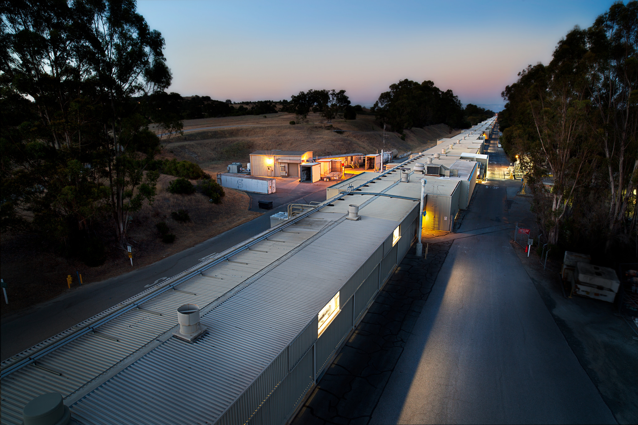 SLAC's two-mile long accelerator klystron gallery, looking east toward Stanford University's main campus. (Photo courtesy SLAC.)