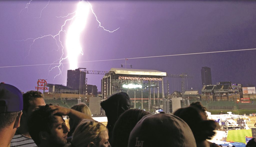 Lightning strikes during a rain delay at Pearl Jam’s July 19, 2013 concert at Wrigley Field, Chicago. (Photo by DRLPhotography)