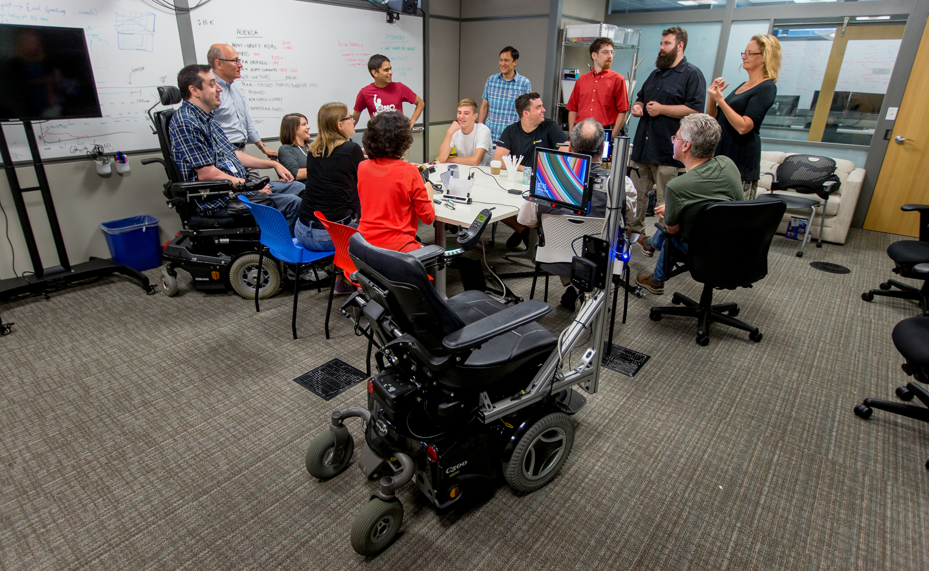 Team members meet in the lab, where they often work on the Eye Gaze Wheelchair.